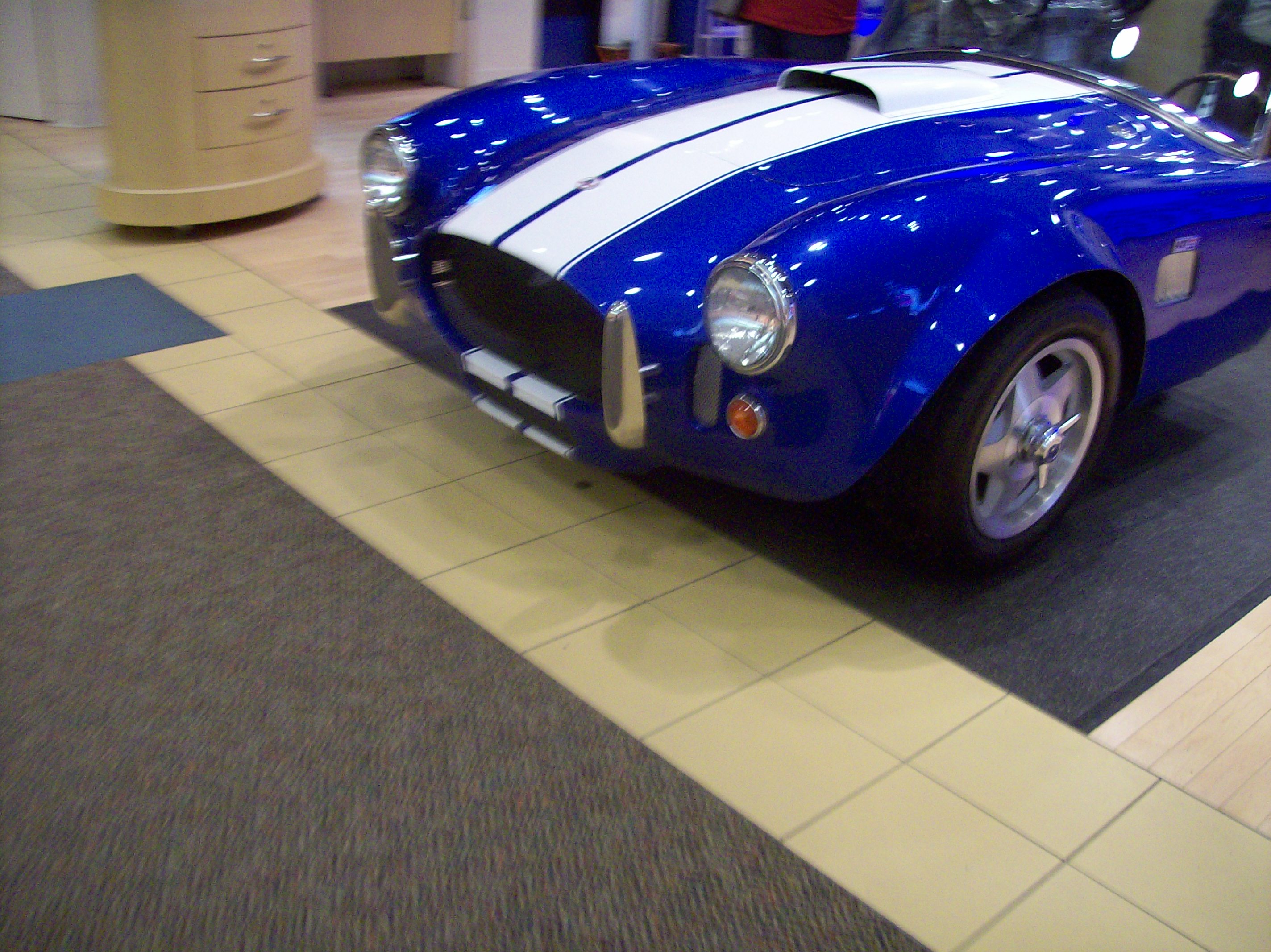 Another front end of a Shelby Cobra replica at a cell phone store ...